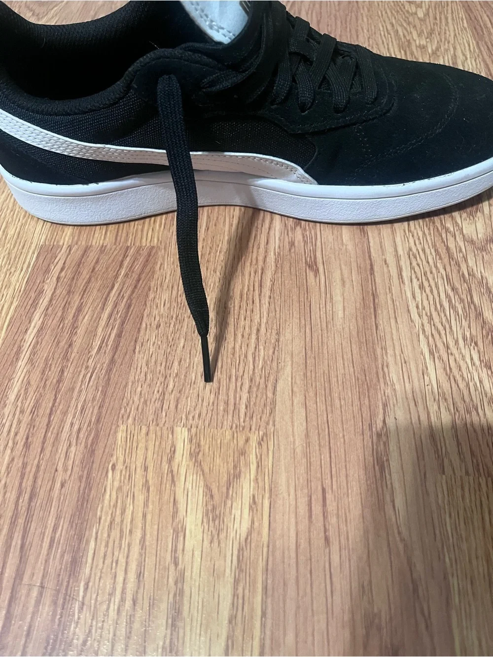 Puma Black Suede Sneakers with White Tongue and Gold Logo